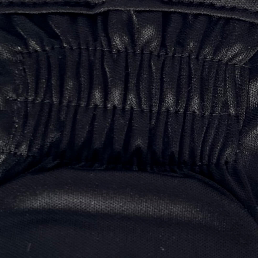 Close up of the gusset located on the waist of the diaper.